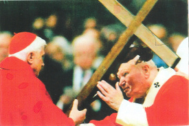 Pope John Paul II passing the Cross to Pope Benedict XVI